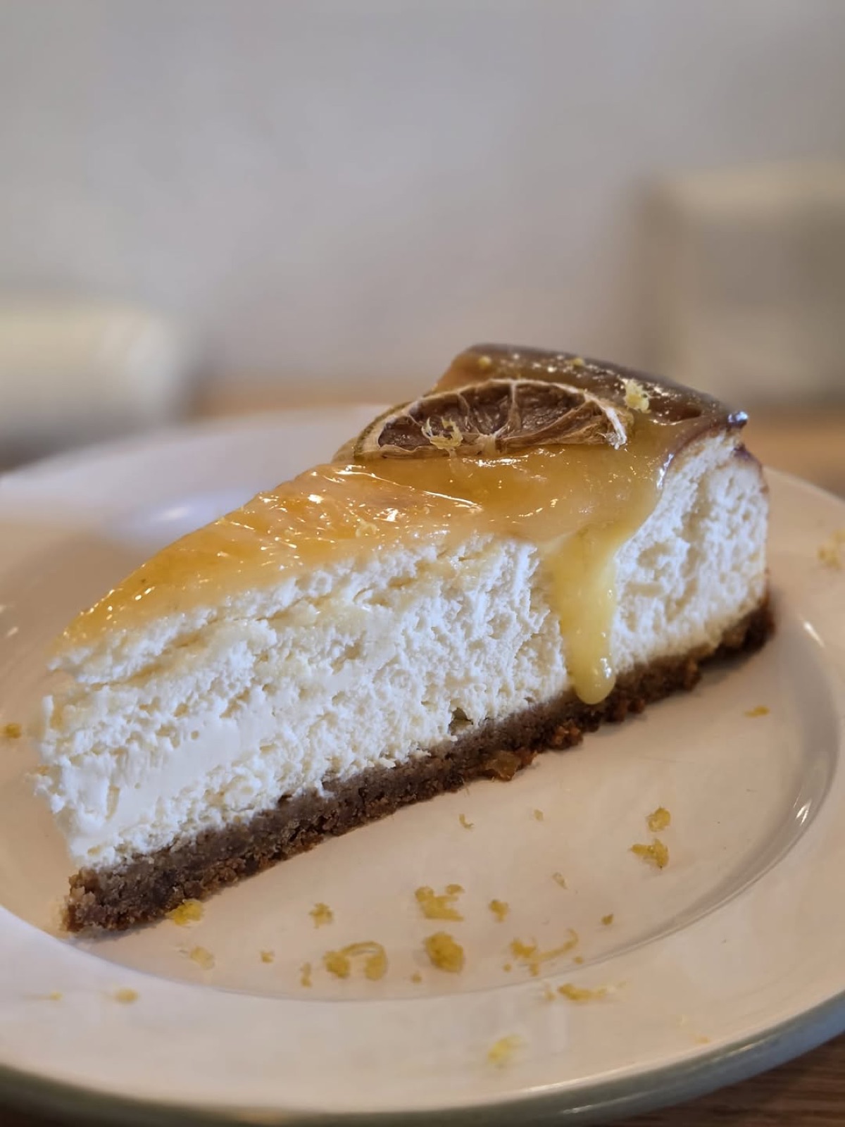 A slice of cheesecake with lemon curd