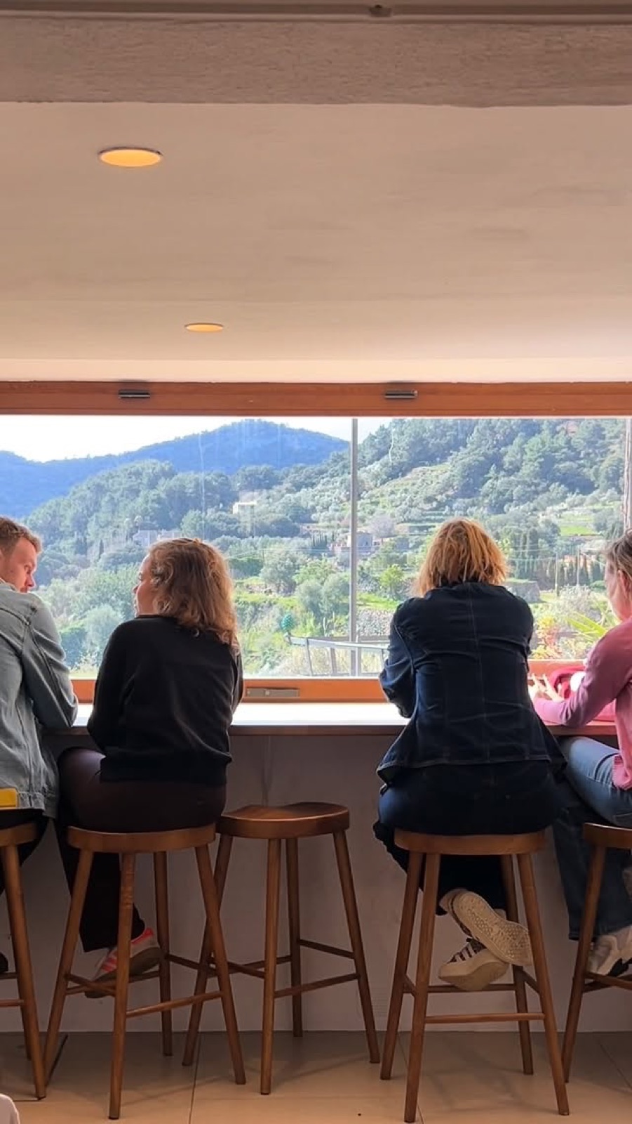 The window bar at Roseta, people seated looking out at the mountains